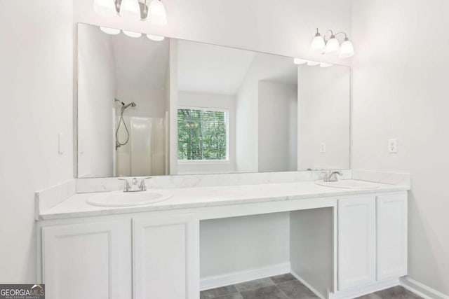 6230 Lillie Ln, Cumming, GA 30040 - bathroom with double vanity, a shower, and baseboards