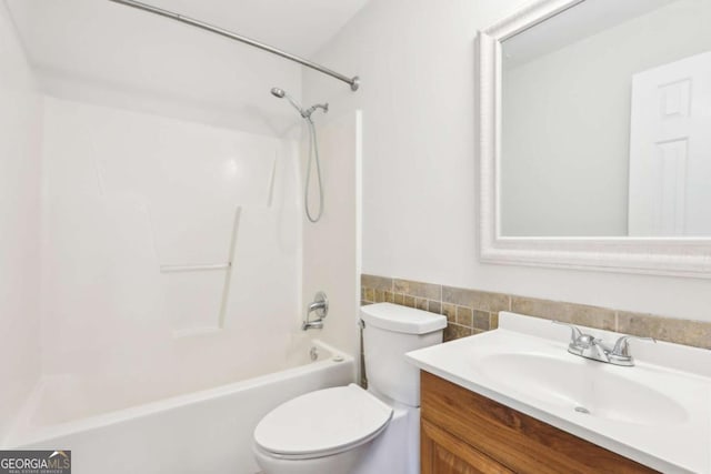 6230 Lillie Ln, Cumming, GA 30040 - full bathroom featuring toilet, vanity,  shower combination, tile walls, and a wainscoted wall