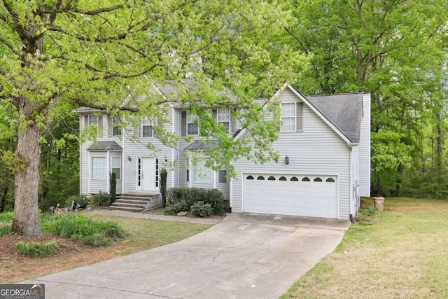 6230 Lillie Ln, Cumming, GA 30040 - colonial home with concrete driveway, an attached garage, a front yard, and a shingled roof