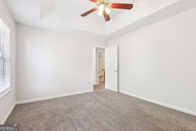 6230 Lillie Ln, Cumming, GA 30040 - carpeted spare room featuring plenty of natural light, ceiling fan, baseboards, and a tray ceiling