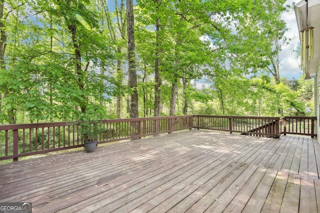 6230 Lillie Ln, Cumming, GA 30040 - wooden deck featuring view of scattered trees