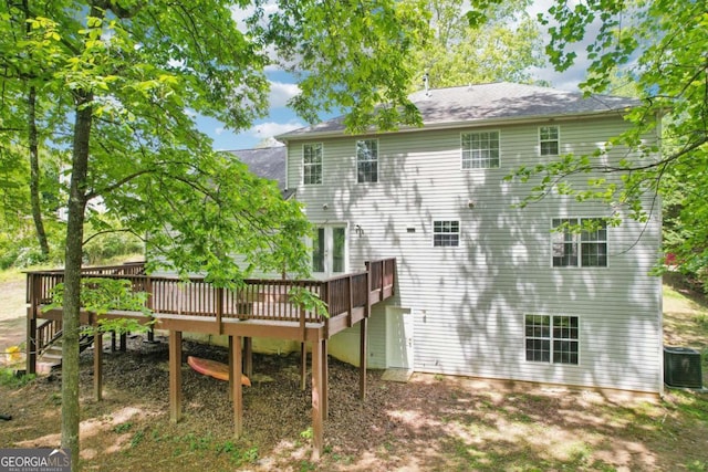 6230 Lillie Ln, Cumming, GA 30040 - back of property featuring cooling unit, a wooden deck, and roof with shingles