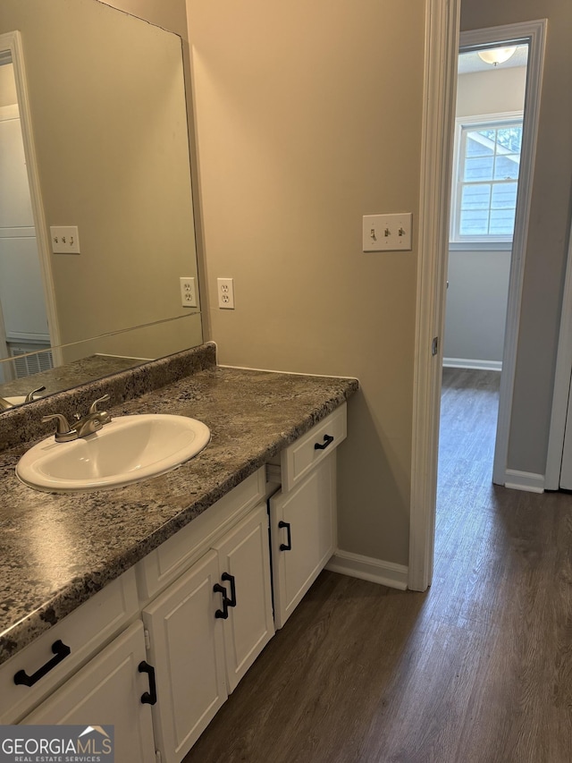 6103 Chaseland Rd, Rex, GA 30273 - bathroom featuring wood finished floors, baseboards, and vanity