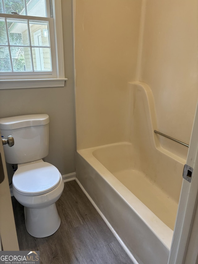 6103 Chaseland Rd, Rex, GA 30273 - full bath featuring baseboards, toilet, wood finished floors, and bathtub / shower combination