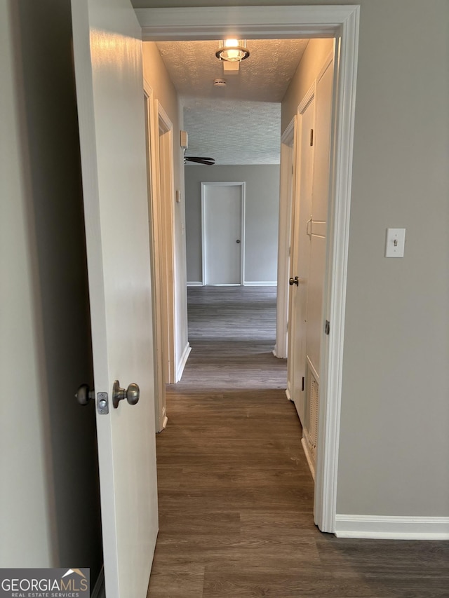 6103 Chaseland Rd, Rex, GA 30273 - corridor with baseboards, dark wood-type flooring, and a textured ceiling