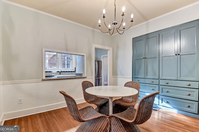570 Southview Dr, Athens, GA 30605 - dining room with a chandelier, light wood-style flooring, ornamental molding, and baseboards