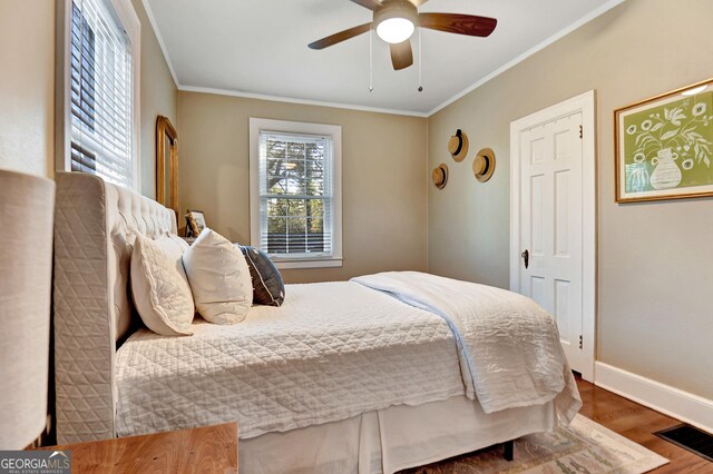 570 Southview Dr, Athens, GA 30605 - bedroom with wood finished floors, crown molding, baseboards, and a ceiling fan