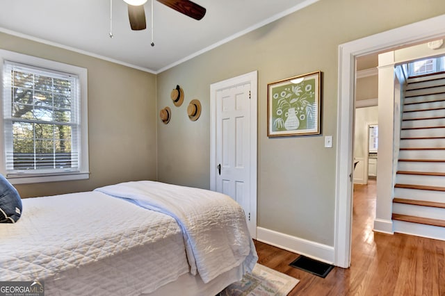570 Southview Dr, Athens, GA 30605 - bedroom featuring wood finished floors, ornamental molding, and baseboards
