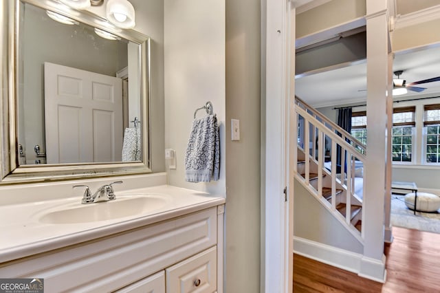 570 Southview Dr, Athens, GA 30605 - bathroom featuring vanity, wood finished floors, ceiling fan, and crown molding