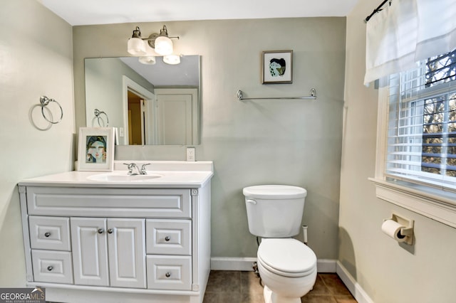 570 Southview Dr, Athens, GA 30605 - bathroom with toilet, vanity, tile patterned flooring, and baseboards