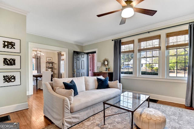 570 Southview Dr, Athens, GA 30605 - living area with a chandelier, baseboards, crown molding, wood finished floors, and a ceiling fan