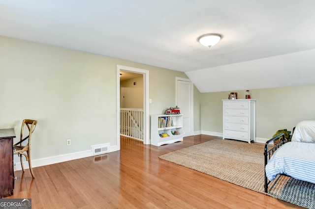 570 Southview Dr, Athens, GA 30605 - bedroom with wood finished floors, baseboards, and vaulted ceiling