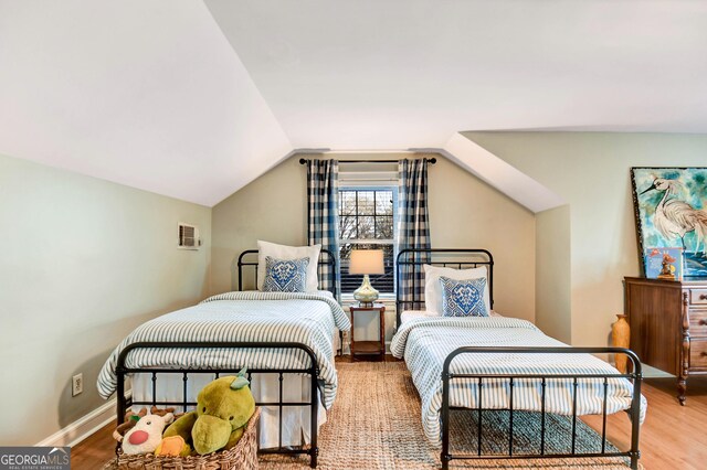 570 Southview Dr, Athens, GA 30605 - bedroom featuring wood finished floors, lofted ceiling, and baseboards