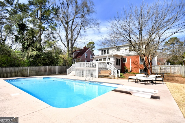 570 Southview Dr, Athens, GA 30605 - view of swimming pool with stairs, a wooden deck, a patio, a fenced backyard, and a diving board