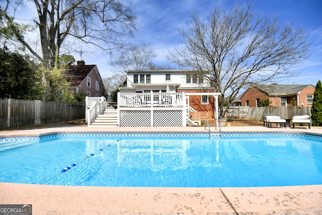 570 Southview Dr, Athens, GA 30605 - view of swimming pool with stairway, a wooden deck, and a fenced backyard