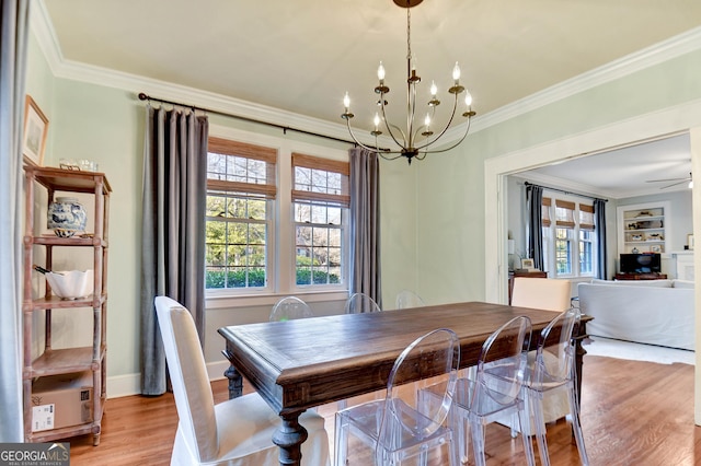570 Southview Dr, Athens, GA 30605 - dining room with ornamental molding, a chandelier, light wood-style flooring, baseboards, and built in features