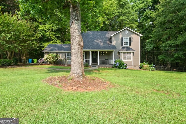 135 Dunwick Ln, Mcdonough, GA 30253 - traditional-style home with covered porch, a front lawn, and roof with shingles