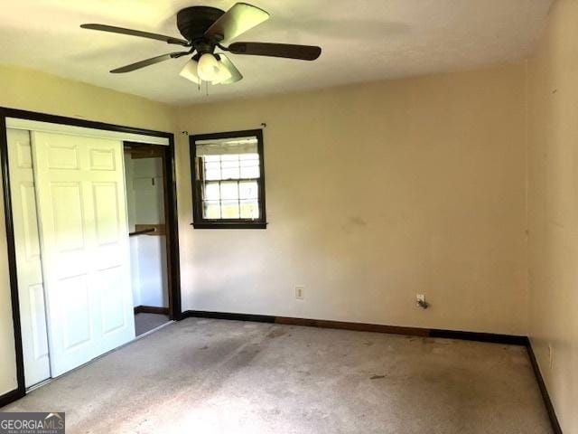 8832 Twin Oaks Dr, Jonesboro, GA 30236 - unfurnished bedroom with carpet flooring, baseboards, a closet, and ceiling fan