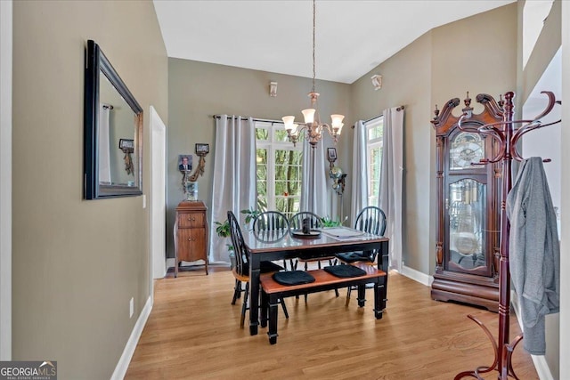 11 Crossbridge Ct, Cartersville, GA 30120 - dining area featuring a chandelier, light wood-style flooring, and baseboards