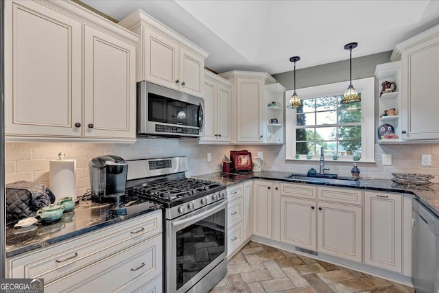 11 Crossbridge Ct, Cartersville, GA 30120 - kitchen with appliances with stainless steel finishes, open shelves, a sink, hanging light fixtures, and decorative backsplash