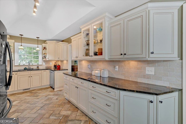 11 Crossbridge Ct, Cartersville, GA 30120 - kitchen with brick patterned floors, hanging light fixtures, decorative backsplash, glass insert cabinets, and vaulted ceiling