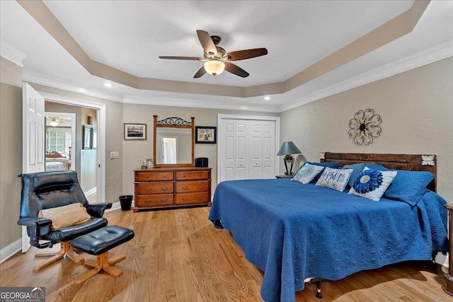 11 Crossbridge Ct, Cartersville, GA 30120 - bedroom with a tray ceiling, ornamental molding, light wood-style floors, a closet, and baseboards