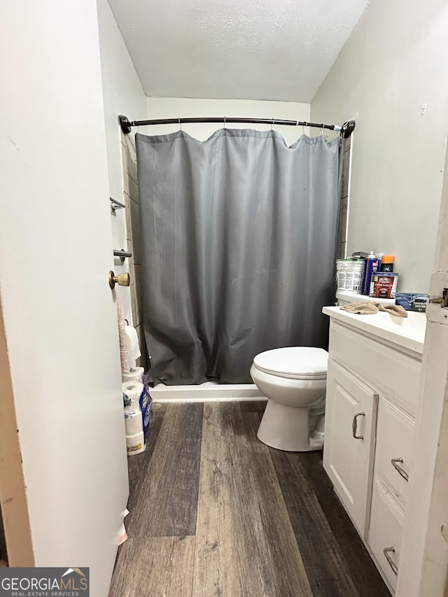 3683 Miller St, Lithia Springs, GA 30122 - full bath with wood finished floors, vanity, and a stall shower