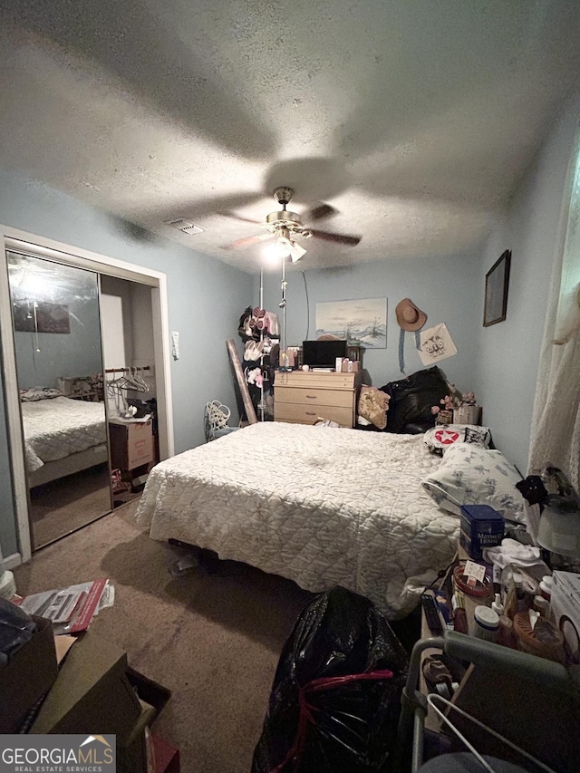3683 Miller St, Lithia Springs, GA 30122 - bedroom with carpet, a textured ceiling, and a ceiling fan