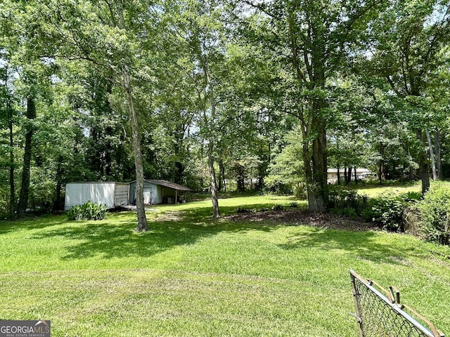 3683 Miller St, Lithia Springs, GA 30122 - view of grassy yard featuring an outdoor structure
