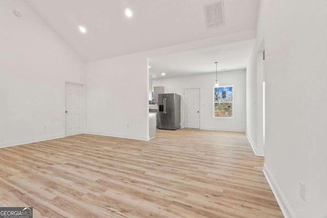 30 Moore Ave, Toccoa, GA 30577 - unfurnished living room featuring light wood-type flooring, recessed lighting, and vaulted ceiling