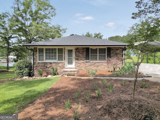 113 Fletcher Rd, Eatonton, GA 31024 - bungalow featuring brick siding, roof with shingles, a front yard, and entry steps