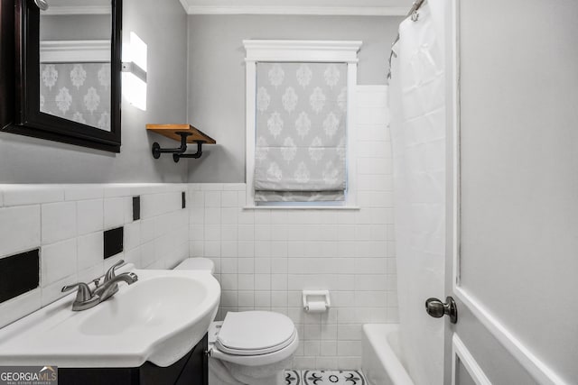113 Fletcher Rd, Eatonton, GA 31024 - full bathroom with vanity, tile walls, toilet, shower / bathtub combination with curtain, and ornamental molding
