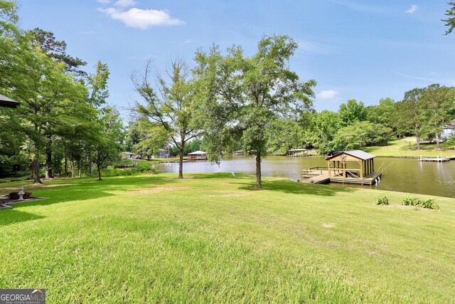 113 Fletcher Rd, Eatonton, GA 31024 - view of green lawn featuring a water view and a dock
