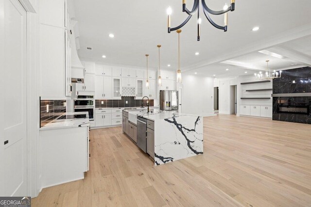 1387 Mineral Springs Rd, Hoschton, GA 30548 - kitchen featuring a chandelier, appliances with stainless steel finishes, decorative backsplash, white cabinets, and recessed lighting
