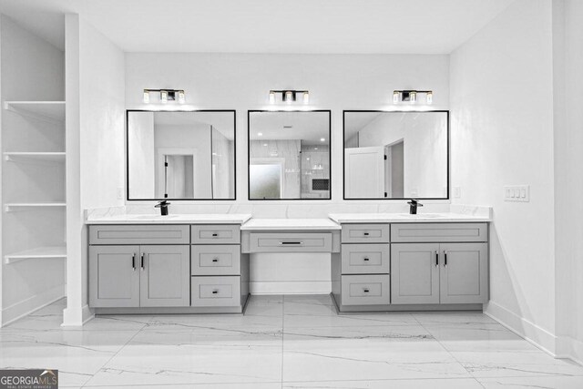 1387 Mineral Springs Rd, Hoschton, GA 30548 - full bathroom with marble look tile flooring, baseboards, two vanities, and a stall shower