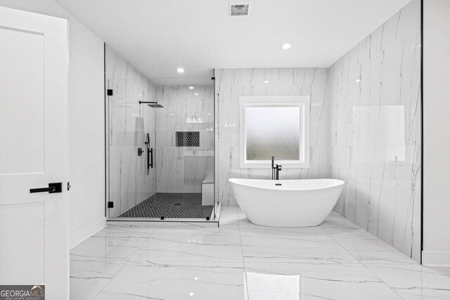1387 Mineral Springs Rd, Hoschton, GA 30548 - bathroom with a marble finish shower, a freestanding bath, marble finish flooring, and recessed lighting