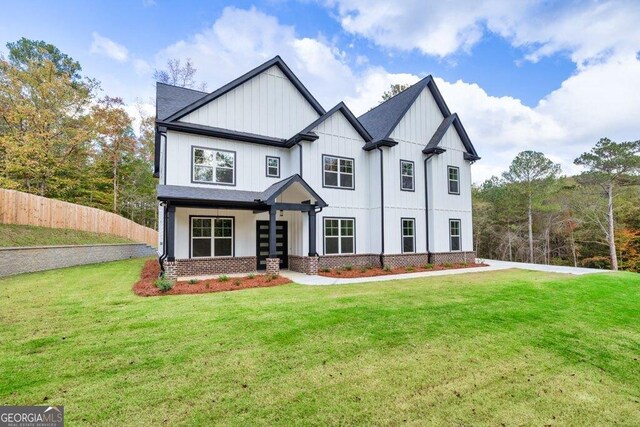 1387 Mineral Springs Rd, Hoschton, GA 30548 - modern farmhouse featuring board and batten siding and brick siding