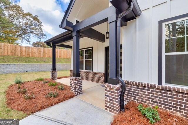 1387 Mineral Springs Rd, Hoschton, GA 30548 - entrance to property with board and batten siding and brick siding