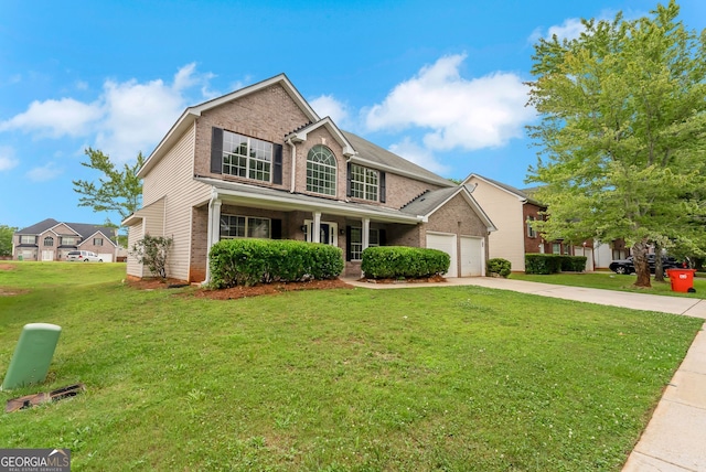 907 Brisley Cir, Hampton, GA 30228 - traditional-style house featuring brick siding, concrete driveway, a front yard, a garage, and covered porch