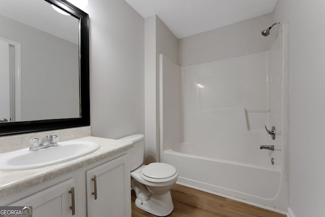 907 Brisley Cir, Hampton, GA 30228 - full bath with vanity, wood finished floors, and bathing tub / shower combination