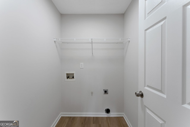 907 Brisley Cir, Hampton, GA 30228 - washroom with electric dryer hookup, hookup for a washing machine, wood finished floors, and gas dryer hookup