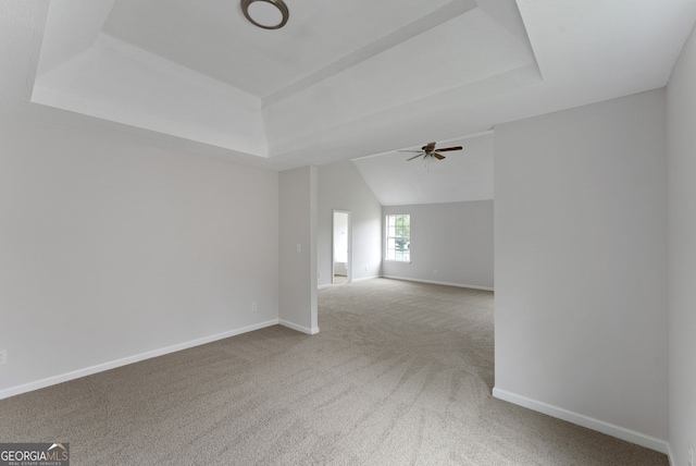 907 Brisley Cir, Hampton, GA 30228 - carpeted spare room with a tray ceiling, ceiling fan, and vaulted ceiling