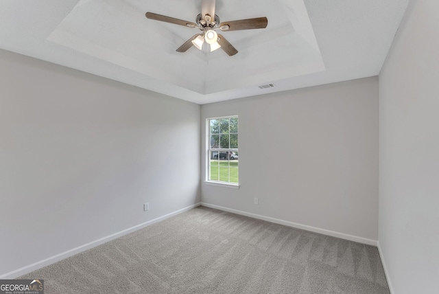 907 Brisley Cir, Hampton, GA 30228 - carpeted spare room with a raised ceiling and ceiling fan
