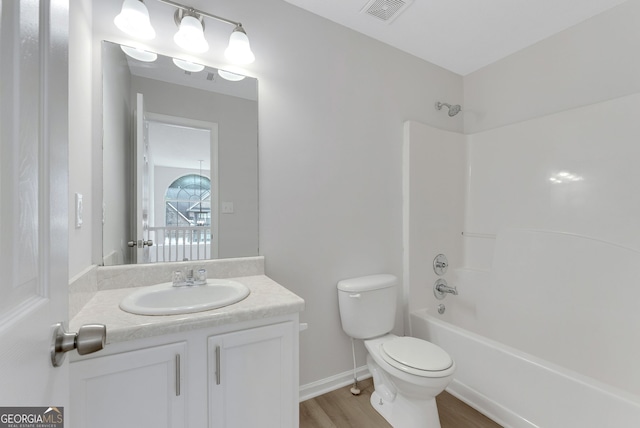 907 Brisley Cir, Hampton, GA 30228 - bathroom featuring vanity, shower / tub combination, and wood finished floors