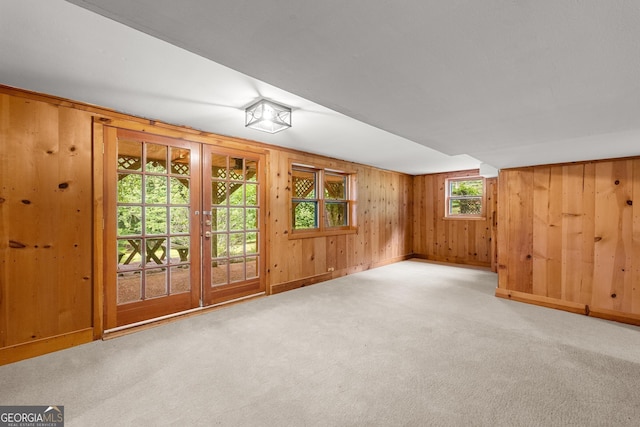 966 Wahoo Creek Rd, Murrayville, GA 30564 - spare room with carpet flooring, wooden walls, and french doors