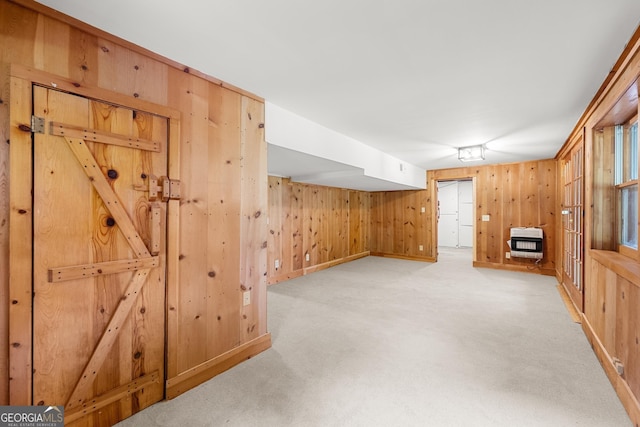 966 Wahoo Creek Rd, Murrayville, GA 30564 - unfurnished living room featuring heating unit, wooden walls, and light carpet