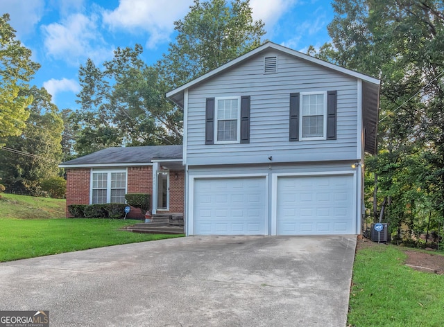 3823 Rock Hollow Ct, Conley, GA 30288 - split level home featuring an attached garage, driveway, a front lawn, and brick siding
