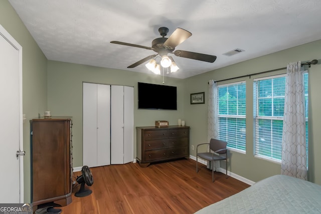 3823 Rock Hollow Ct, Conley, GA 30288 - bedroom featuring wood finished floors, a closet, and ceiling fan