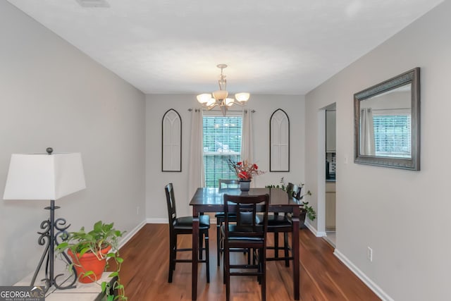 3823 Rock Hollow Ct, Conley, GA 30288 - dining space featuring dark wood-style flooring and a chandelier