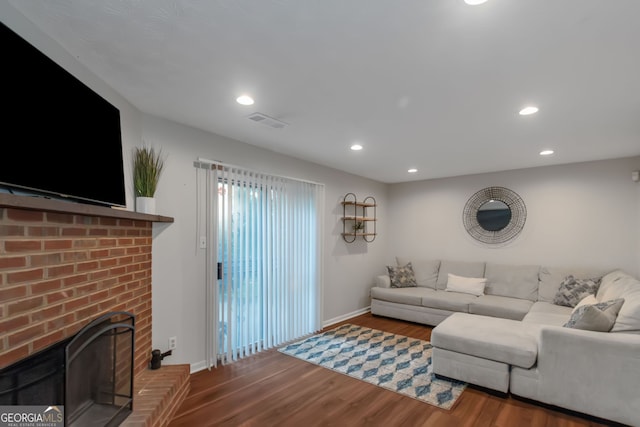 3823 Rock Hollow Ct, Conley, GA 30288 - living area featuring wood finished floors, recessed lighting, and a brick fireplace